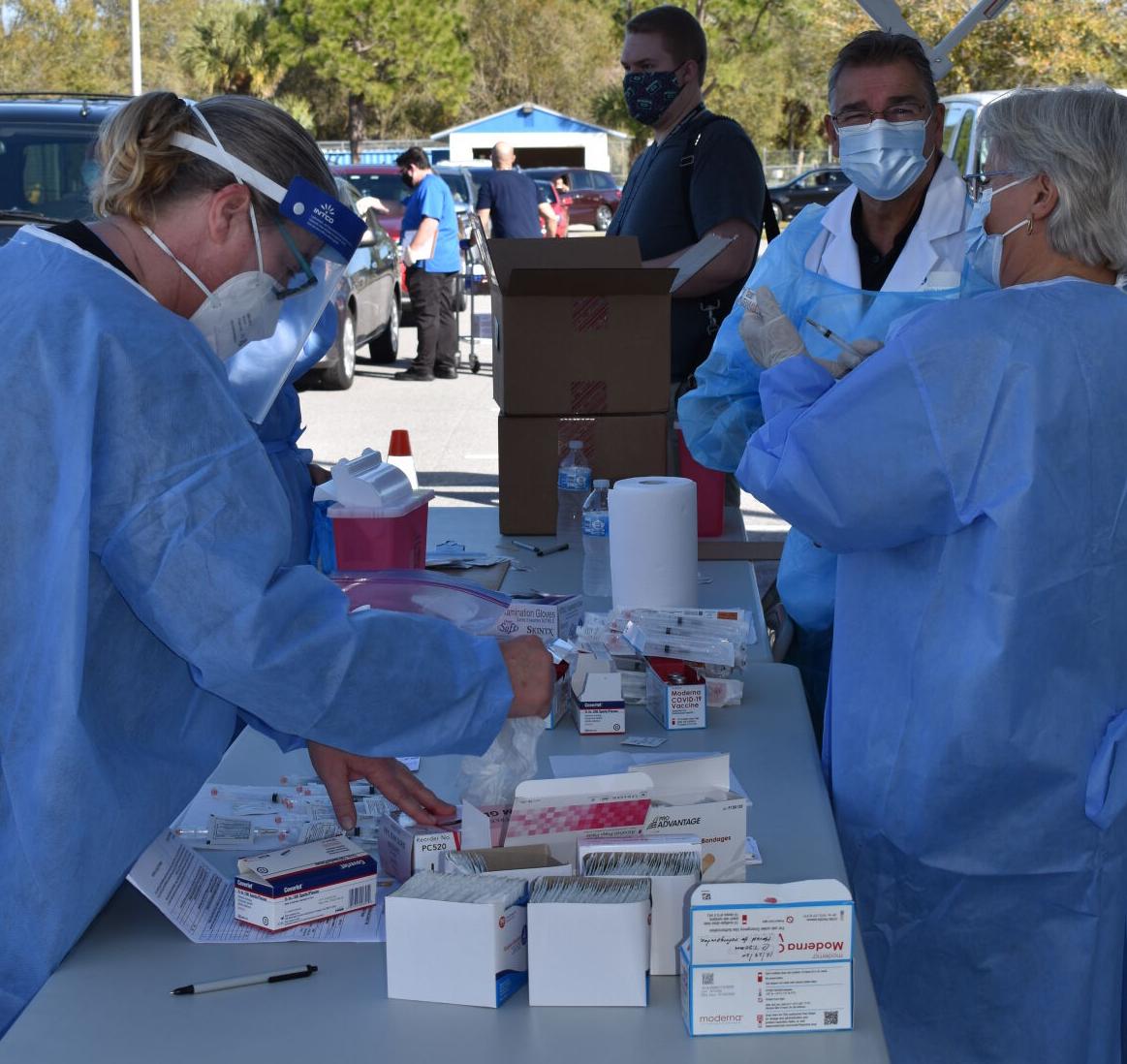 Nurse Peg O'Hara and pharmacist Gary Alore, both retired, served as volunteers.